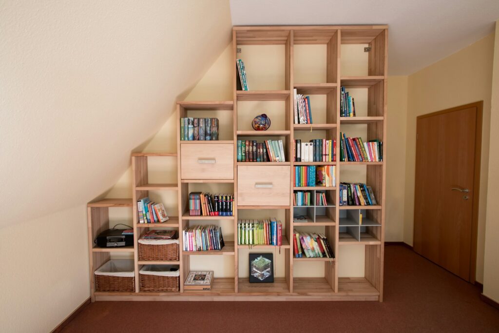 brown wooden shelf with books